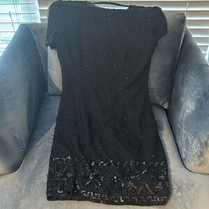 Gorgeous silk, hand beaded and sequin evening dress. Size 6. Knee length.